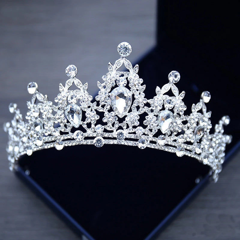 A luxurious silver rhinestone wedding crown featuring a symmetrical, arched design densely packed with clear gemstones that catch the light, perfect for a bride, prom, or pageant. - chinatopmarket