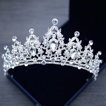 A luxurious silver rhinestone wedding crown featuring a symmetrical, arched design densely packed with clear gemstones that catch the light, perfect for a bride, prom, or pageant. - chinatopmarket